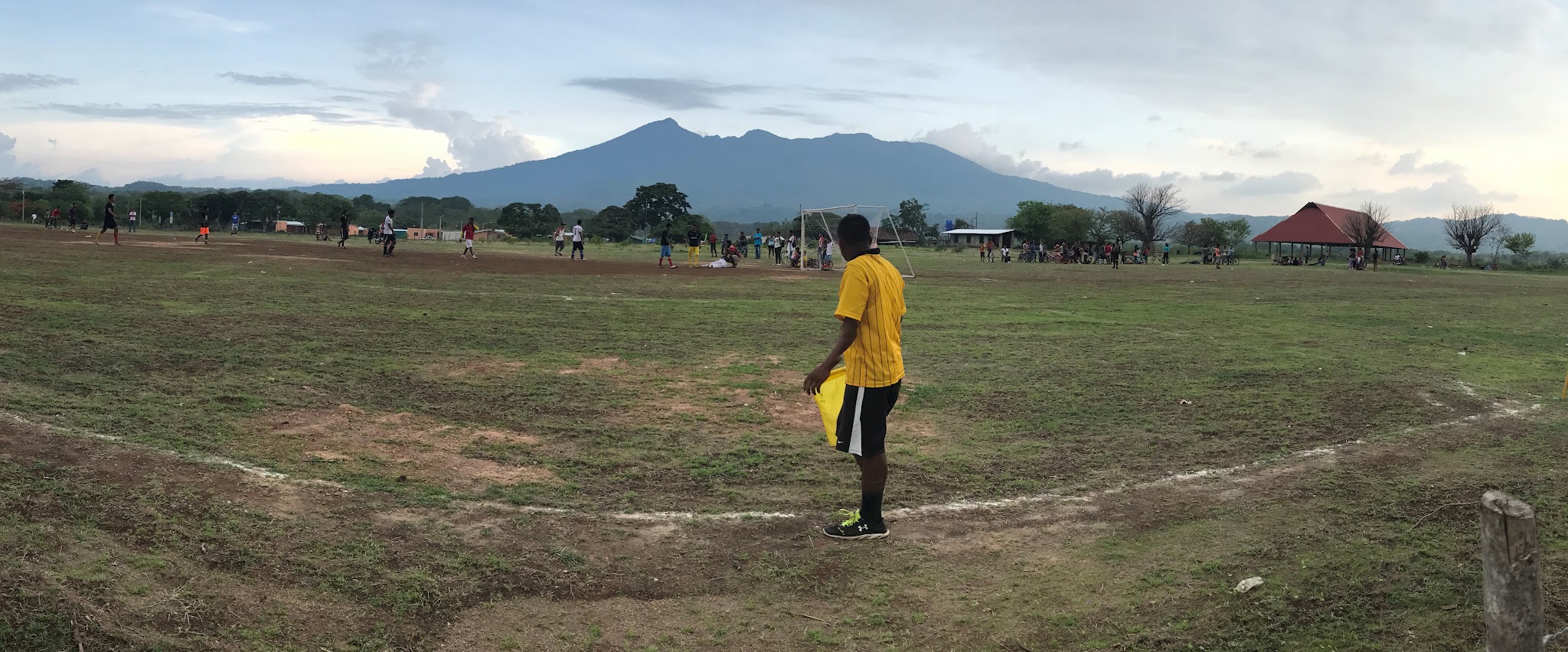 Bike climb of Mombacho Volcano - soccer field with volcano in background