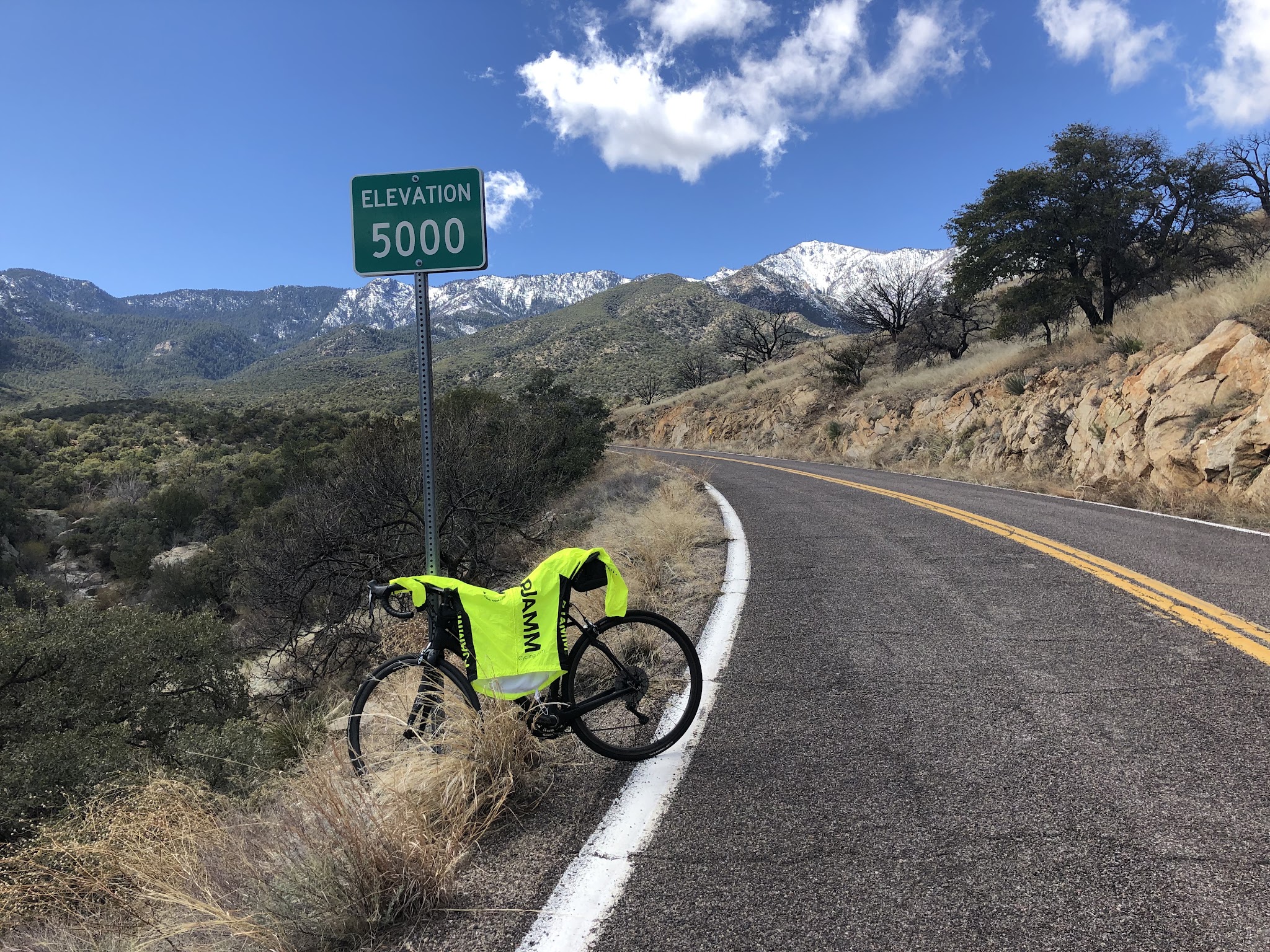 Bike climb Arizona top bike climbs - bike with pjamm jacket at 5000' elevation sign