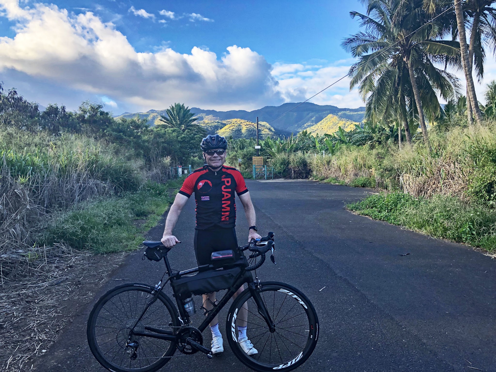 Bike climb of Mokuleia Forest Reserve Road - PJAMM cycling at the start. 