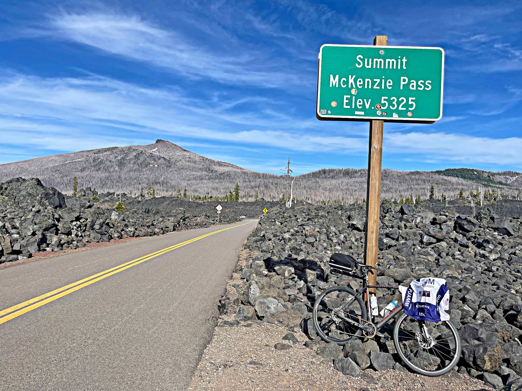 bike parked next to Summit sign on McKenzie Pass