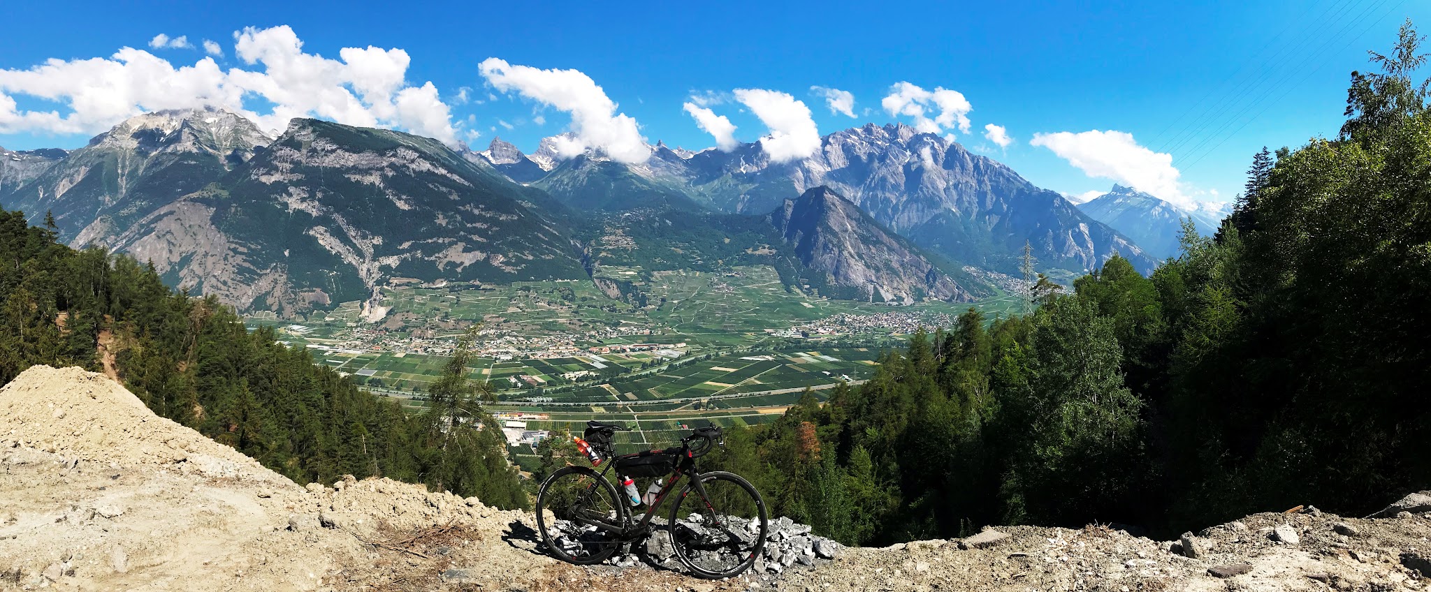 Cycling Top Swiss bike climbs near Sion - Croix de Coeur-Riddes - bike with valley and mountains in background