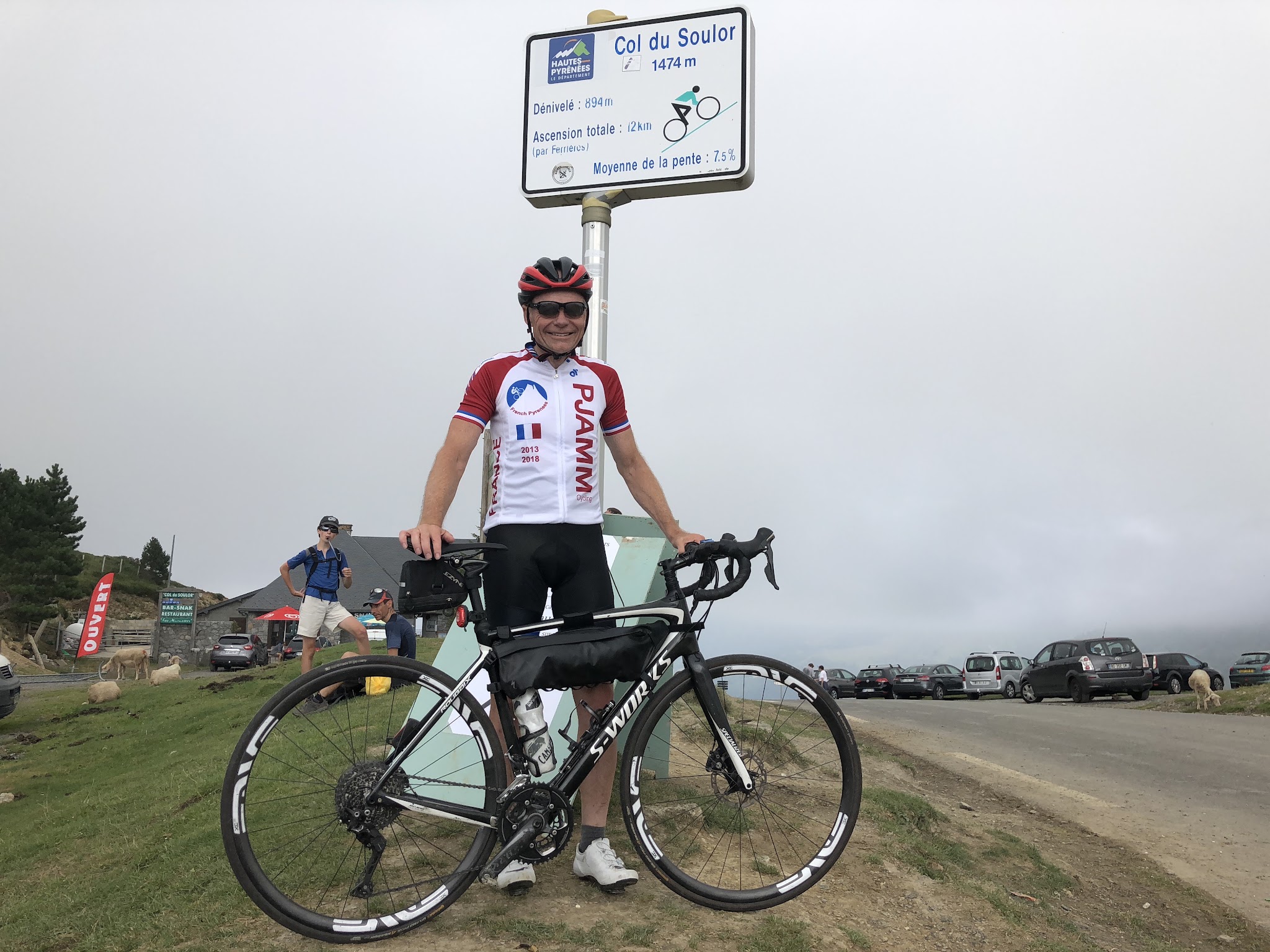 Cycling Col du Soulor from Arrens - PJAMM John Johnson with bike at col sign