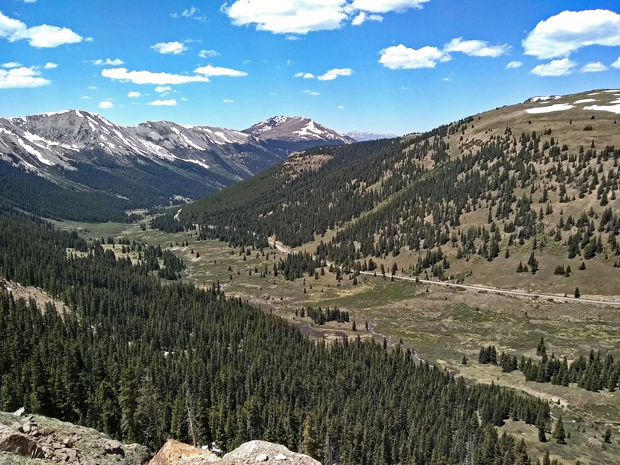 Cycling Independence Pass from Aspen, Colorado - view from above looking down on roadway in valley below