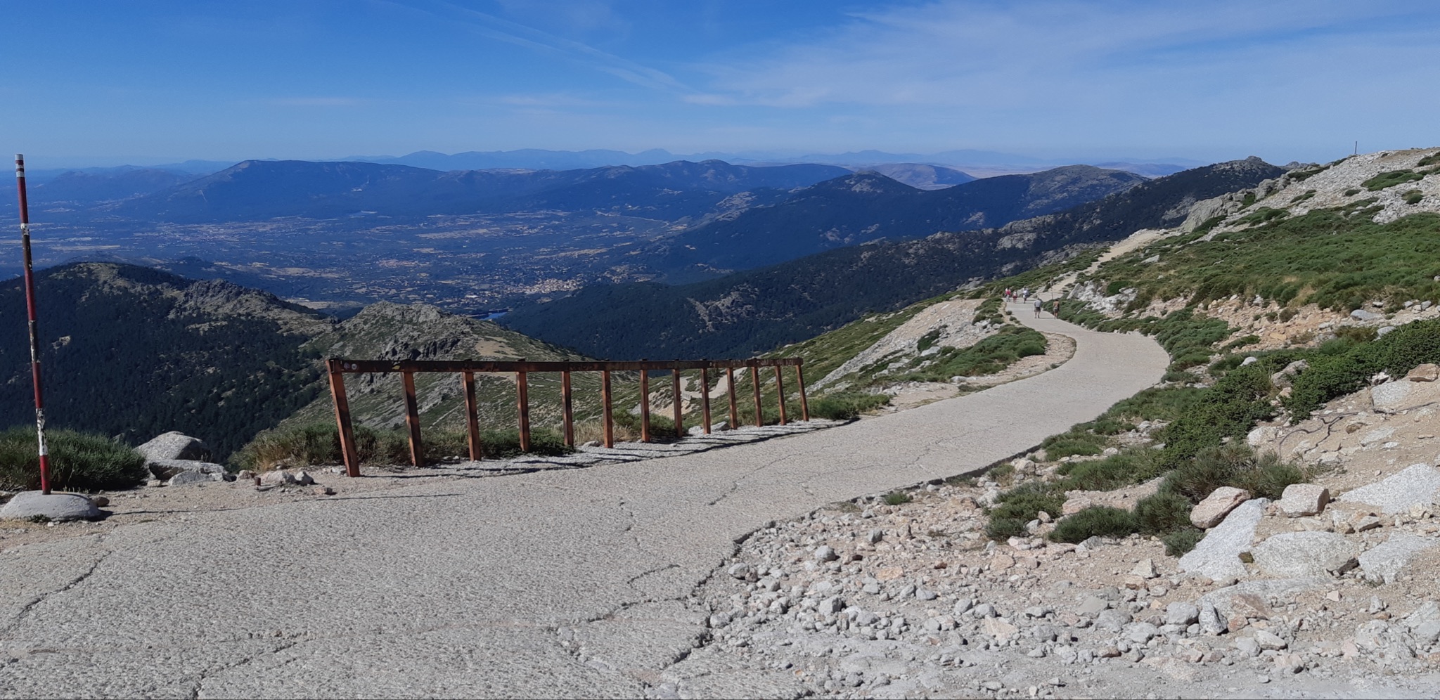 Cycling Bola del Mundo vía Puerto Navacerrada, Spain - narrow, cracked road toward the climb summit