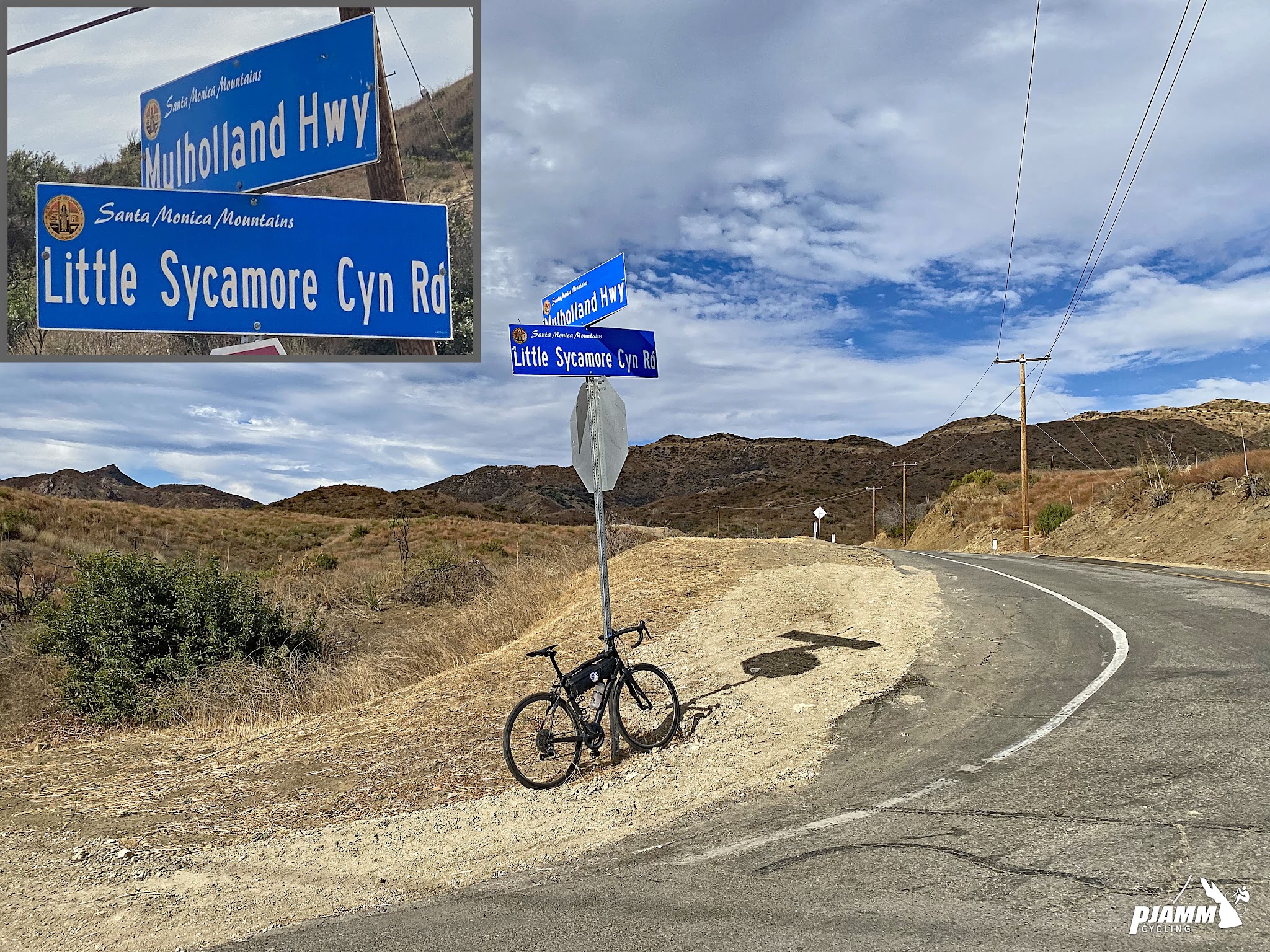 Cycling decker Road to Yerba Buena high point - bike parked next to stop sign at intersection of Mulholland Highway and Little Sycamore Canyon Road