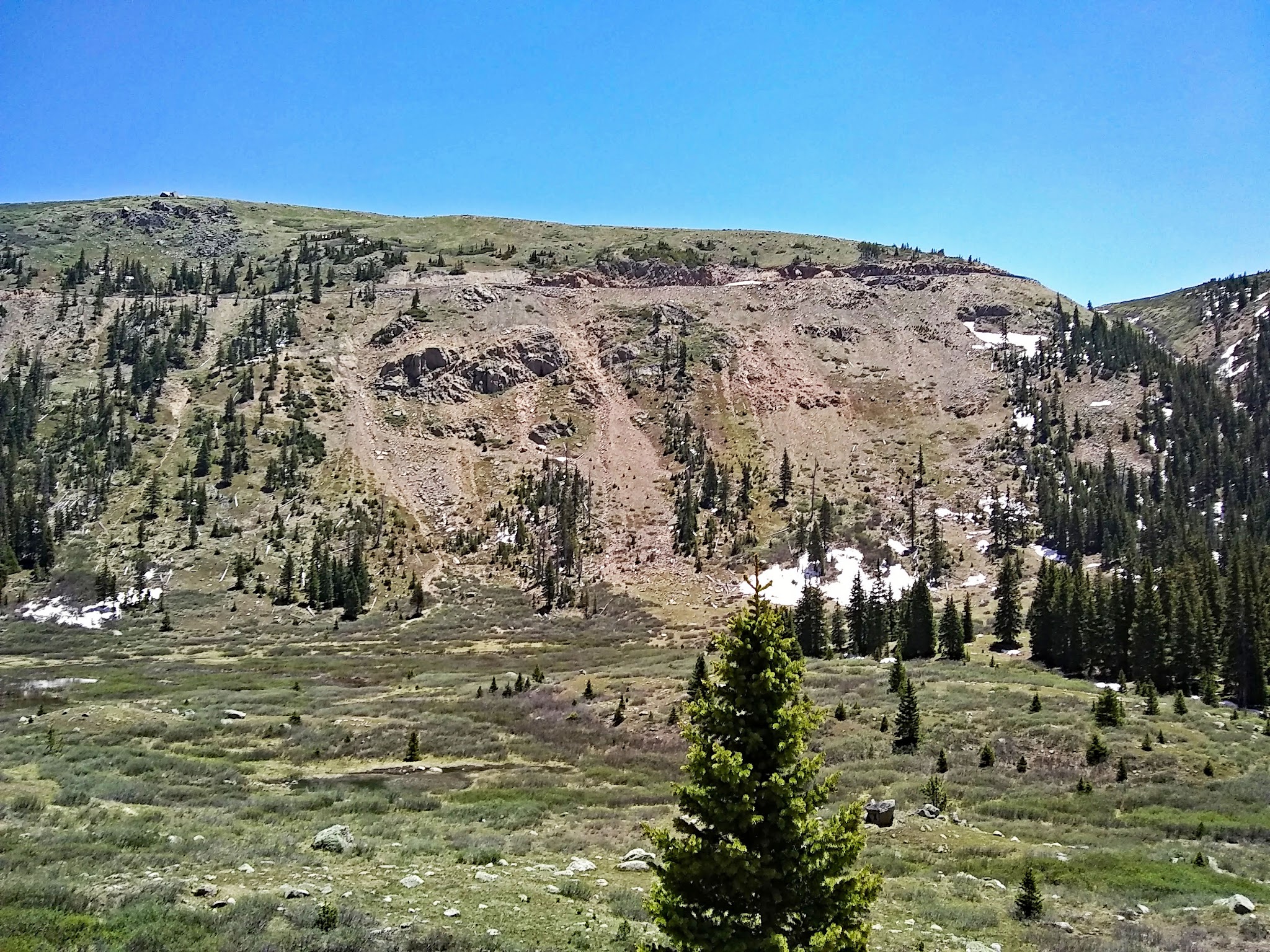 Cycling Independence Pass from Aspen, Colorado - view of valley looking across to roadway along mountainside 