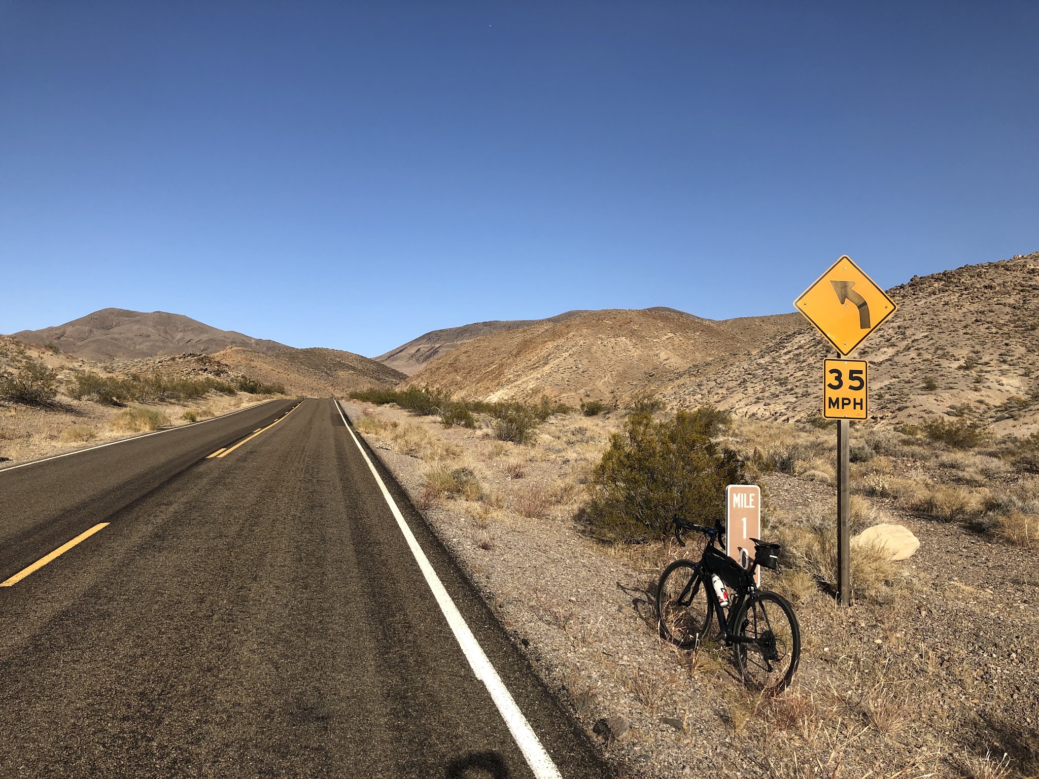 Bicycle ride Daylight Pass Death Valley - bicyclist on bike on road