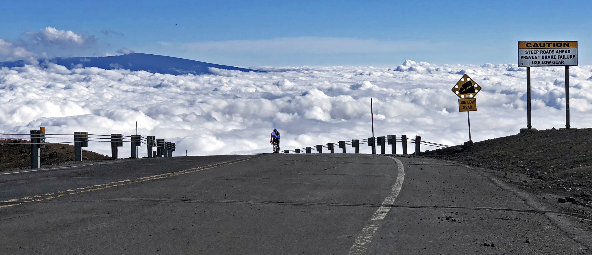 Cycling Top World Bike Climbs - road, volcano, clouds on Mauna Kea