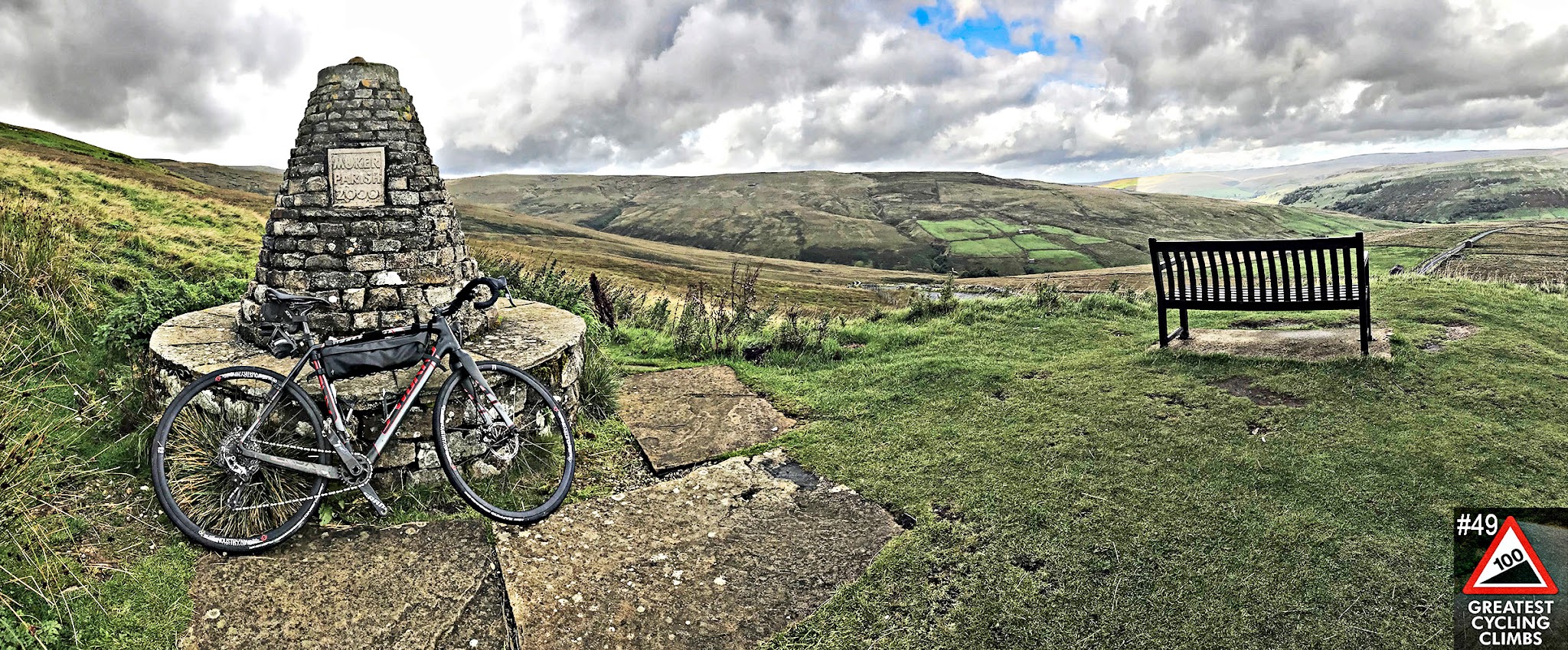bike parked in front of stone monument in Scottish Highlands