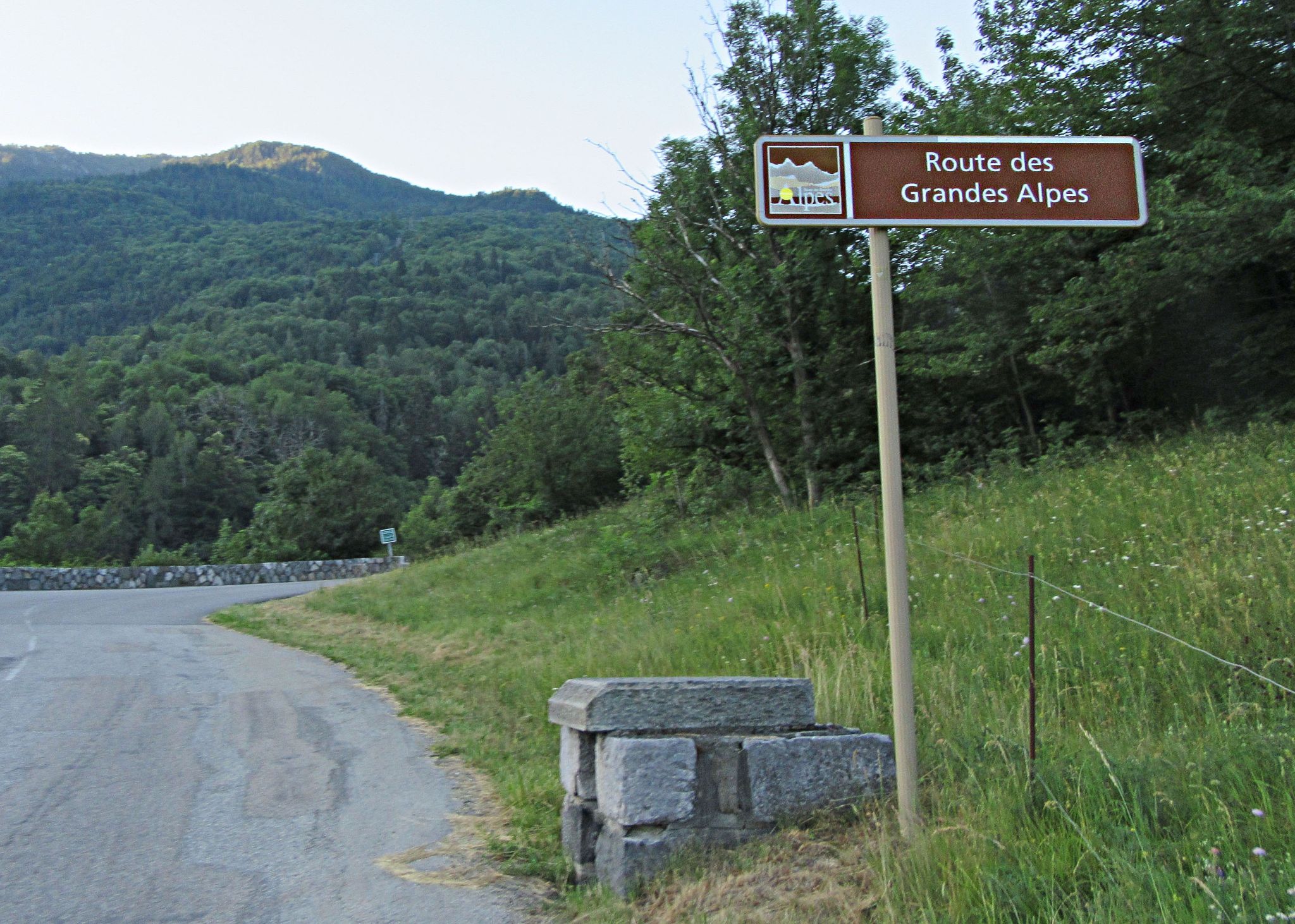 Cycling Col du Galibier & Telegraphe: stone bricks next to sign for Route des Grandes Alpes