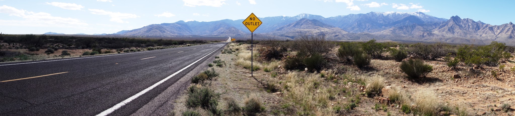 Beginning of the Mt. Graham road bike climb - sign, roadway and mountains