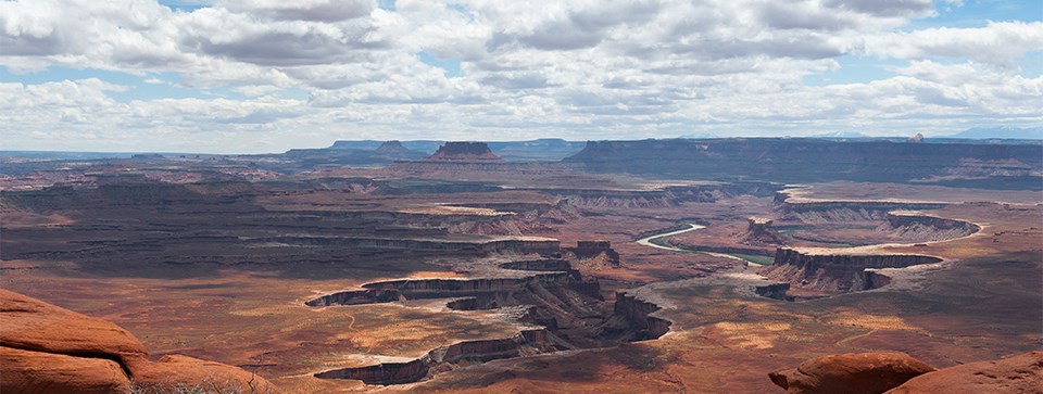 Cycling Canyonlands National Park Cycling Canyonlands National Park - panoramic view of canyons and plateaus and red rock formations at Green River Overlook