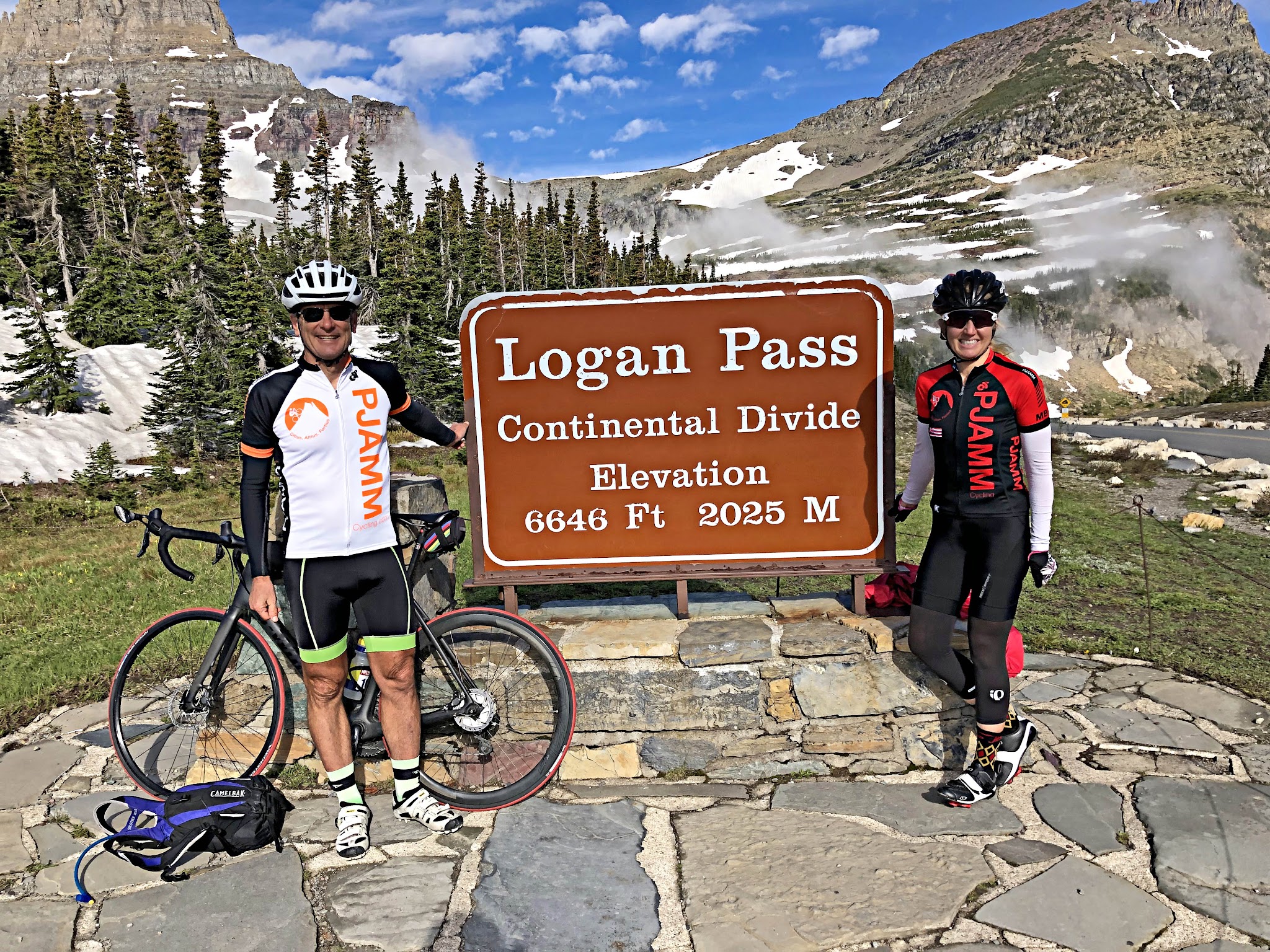 Bicycling Going to the Sun Road - Logan Pass - PJAMM Bruce Hamilton and Stacy Topping at the pass and continental divide