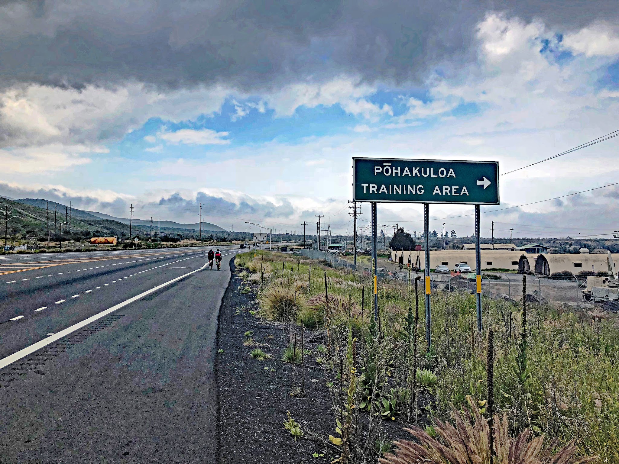 Cycling Mauna Kea from the West  - road sign points to Pohakuloa Training Center