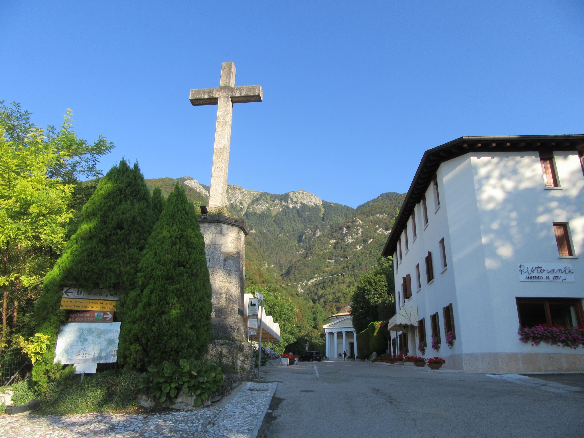 Bike climb of Monte Grappa from Crespano  - Santuario del Covolo, cross, mountain in background