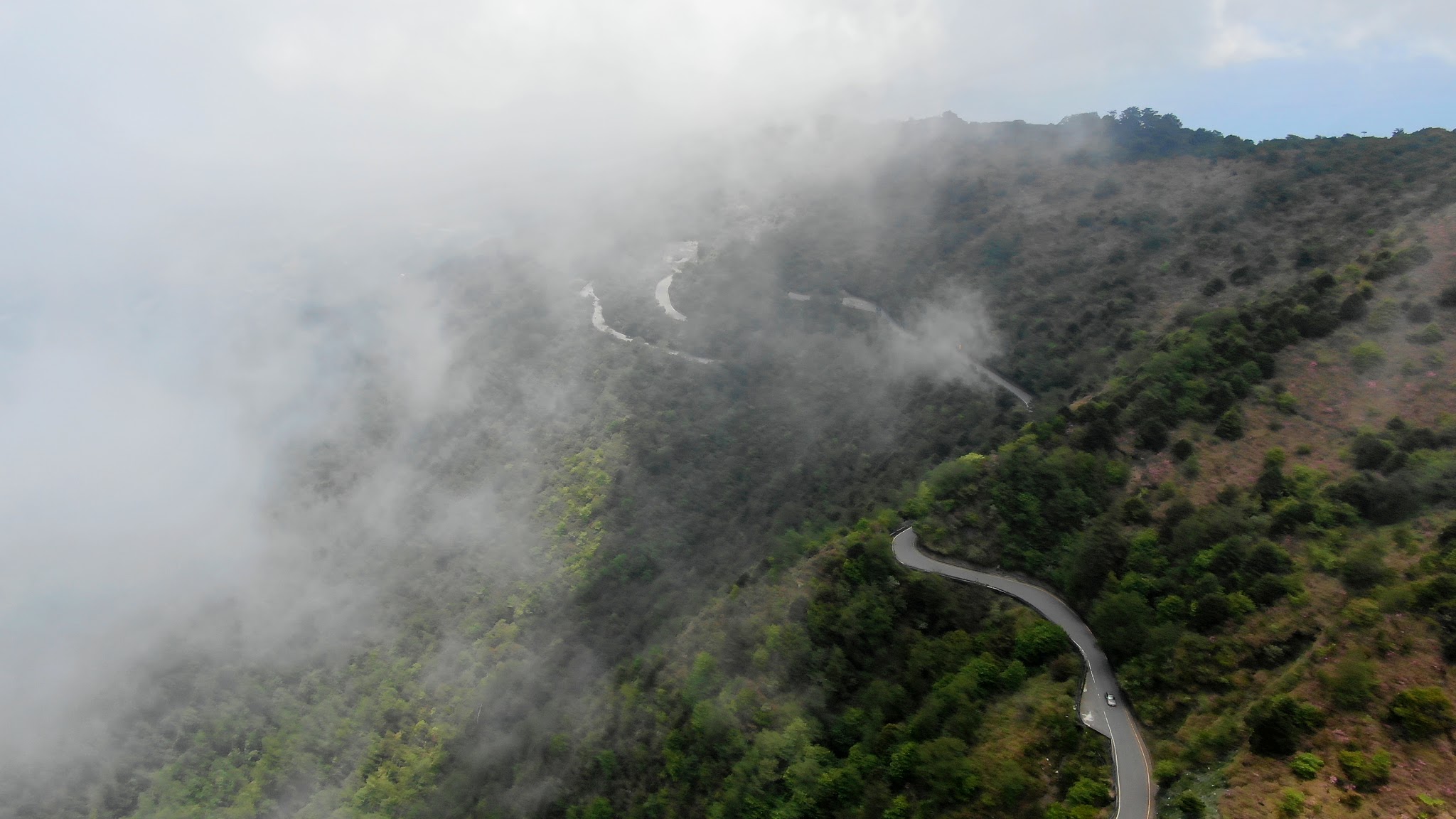 Cycling Wuling Pass West - aerial drone photo of steep cliffs