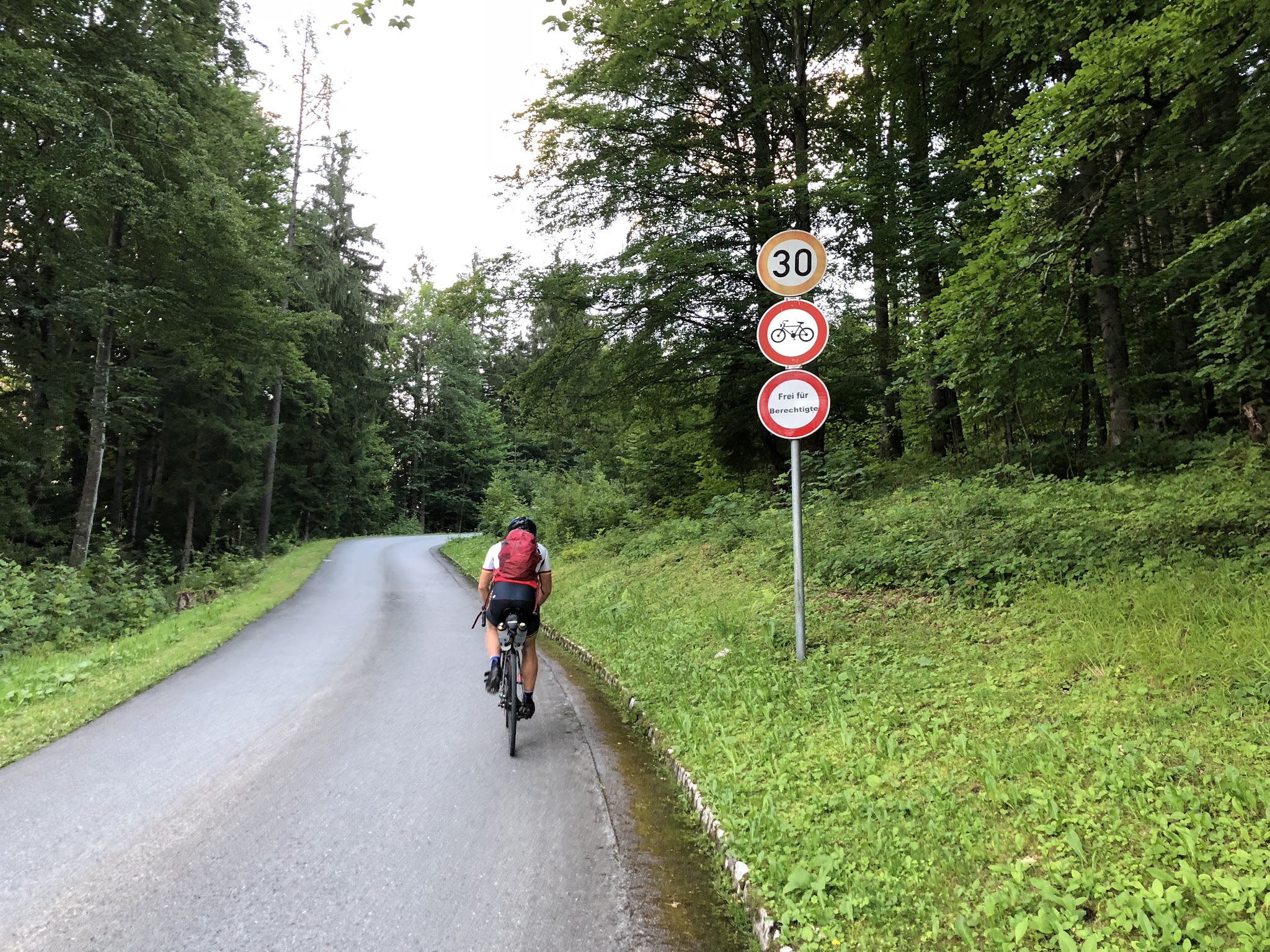 Cycling Germany - Kehlsteinhaus - cyclist riding past no cycling sign.