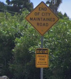 Cycling Big Rock Drive to Stunt Road - road sign reads "End of City Mandated Road, Dead End, Private Road"