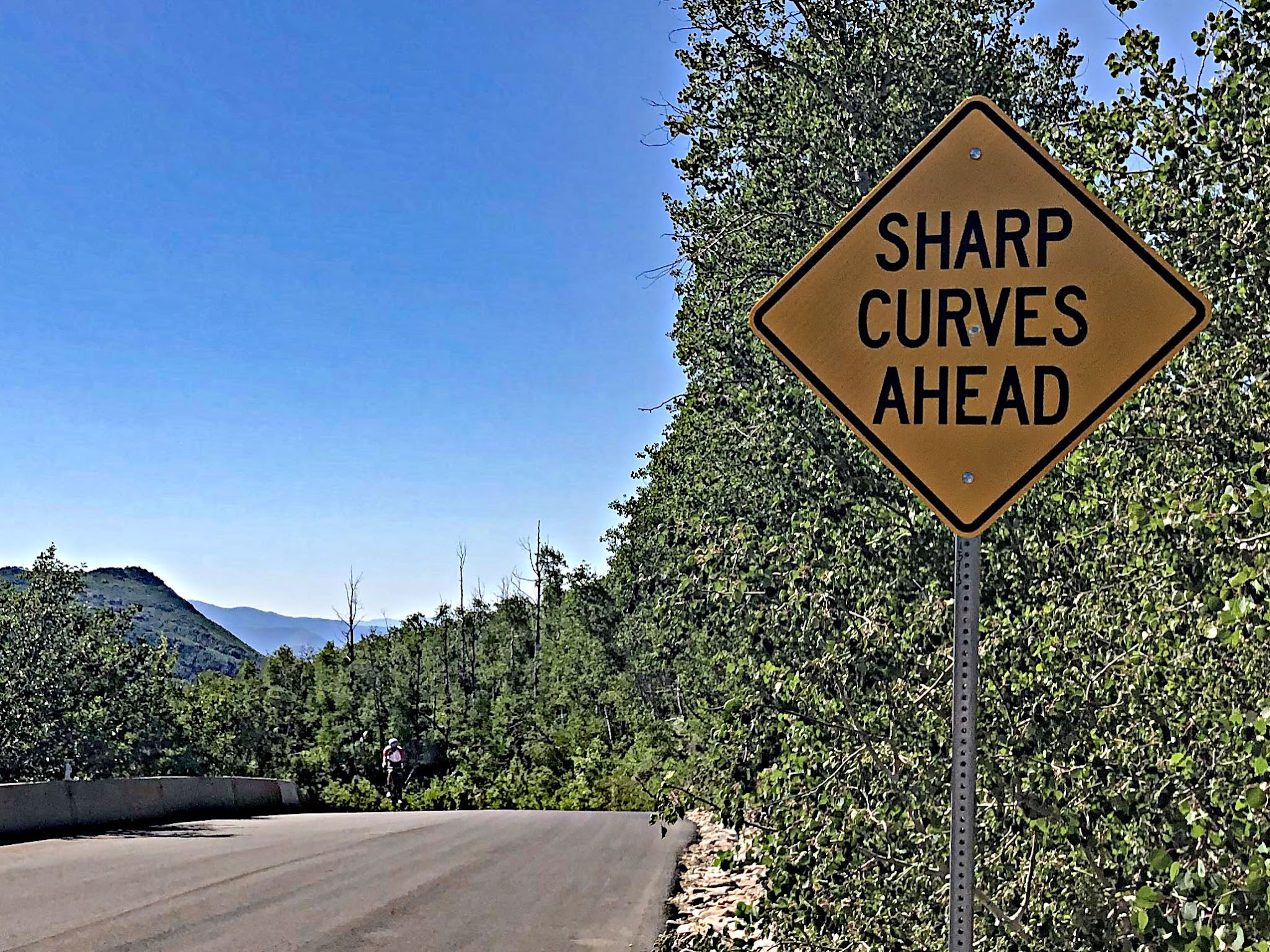 Bike ride Empire Pass from Midway - sharp curve sign
