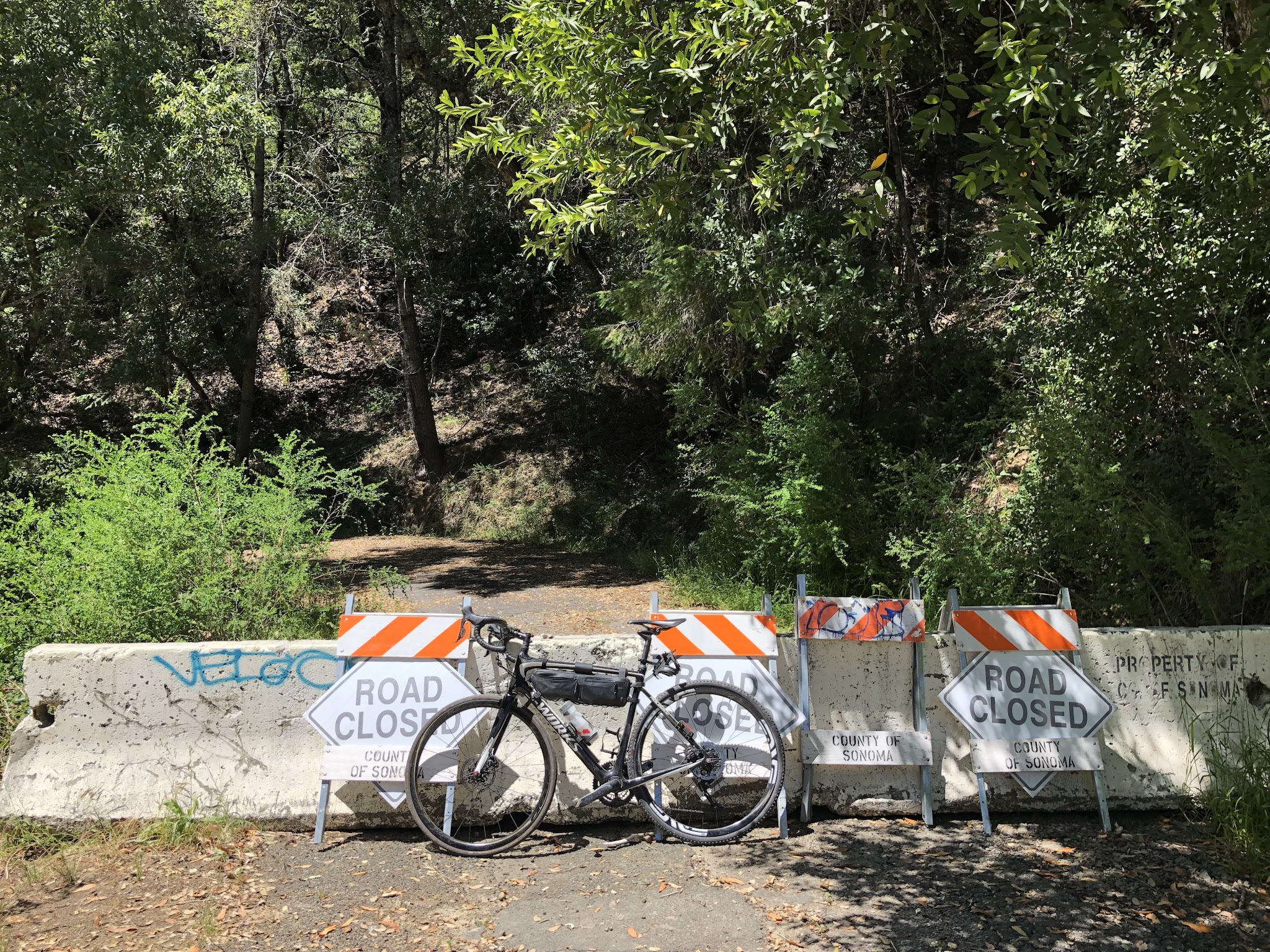 Cycling Old Cazadero Road  - bike leaning against barriers near the end