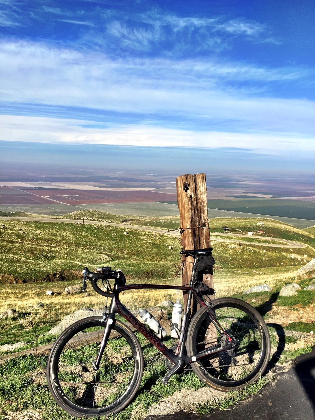 Bike climb of The Bear - start of climb, gate with mountains in background