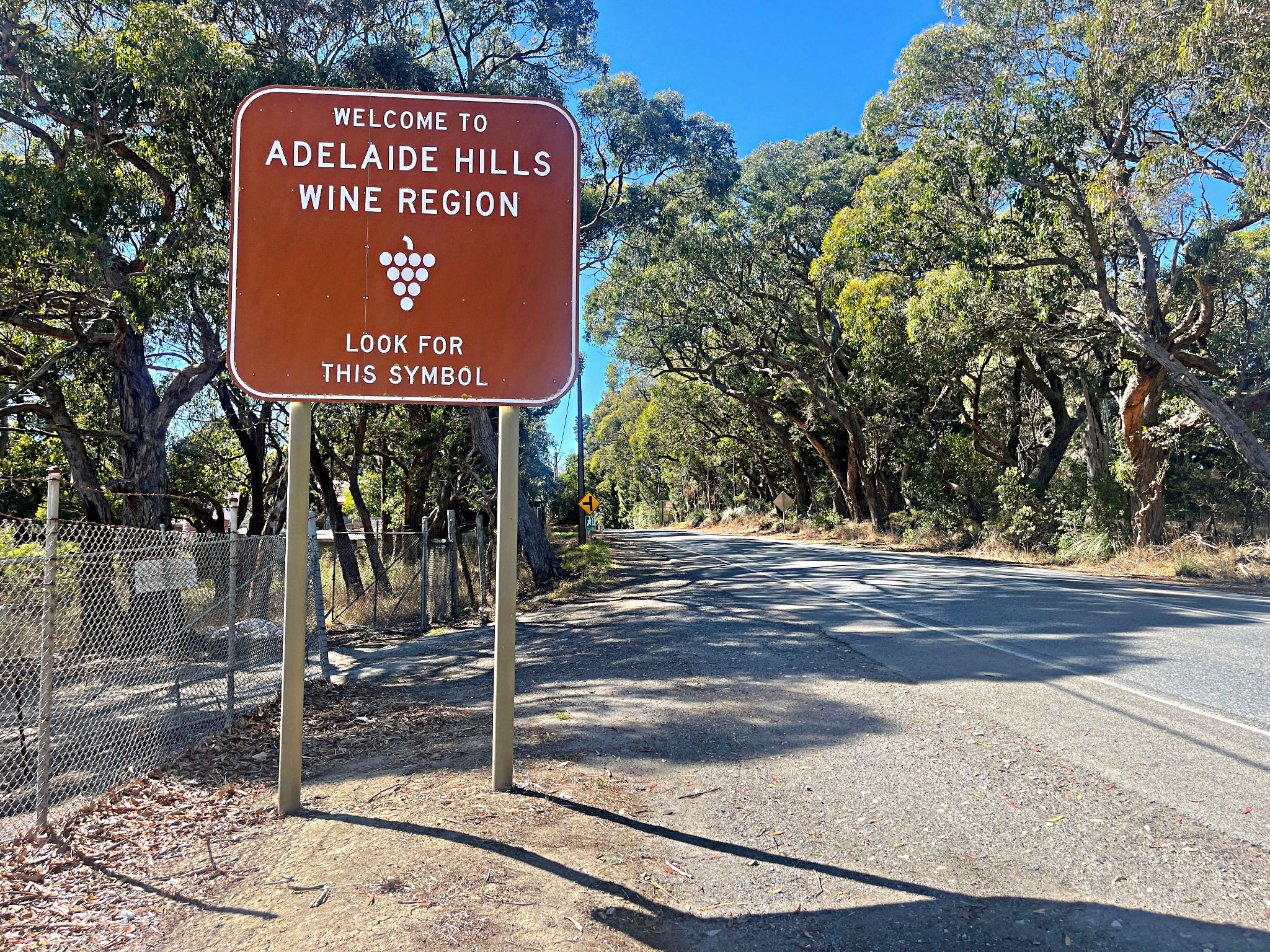 road sign reads "Welcome to Adelaide Hills Wine Region"