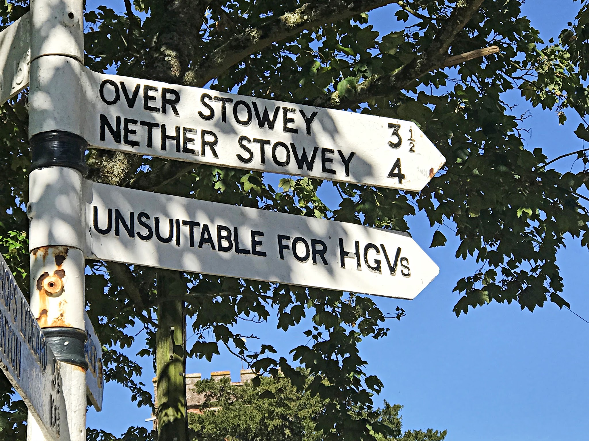 Climbing Crowcombe Comb, Somerset - old white street signs for Over Stowey and Nether Stowey, noting Unsuitable for HGVs