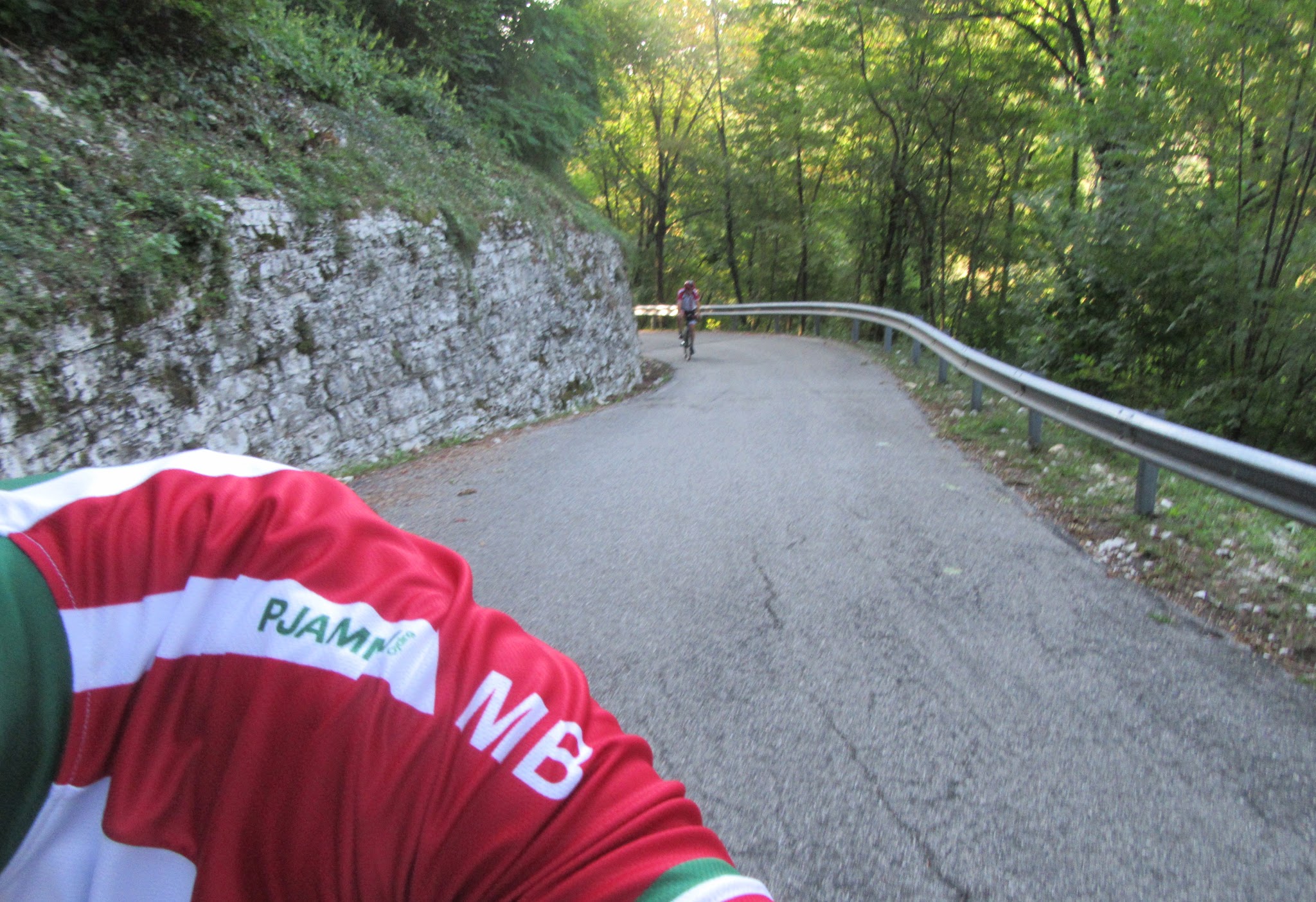 Cycling Monte Grappa - Cavaso del Tomba - roadway and cyclist