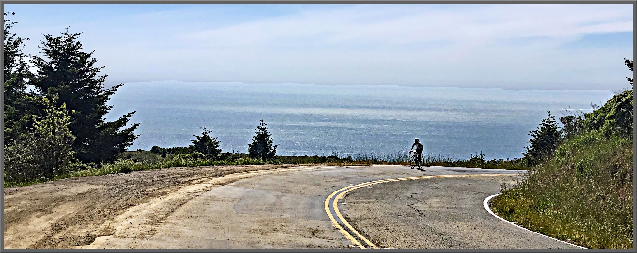 Cycling Mt. Tamalpais from Panoramic Highway South Cycling Mt. Tamalpais from Panoramic Highway South - cyclist climbing up two-lane roadway overlooking ocean
