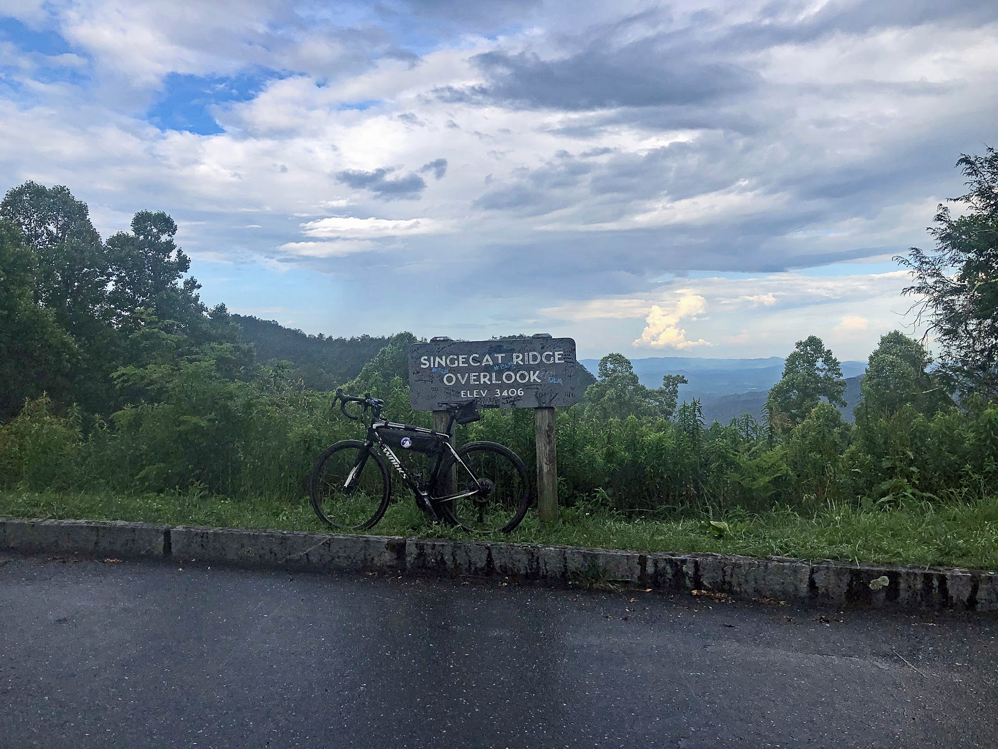 Climbing Mt. Mitchell by bike - Singecat Ridge Overlook sign, bike leaning against sign, Blue Ridge Mountains