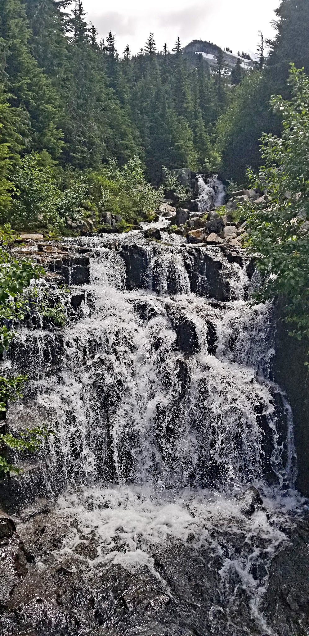 Cycling Mt. Rainier, Stevens Canyon, Washington - waterfall made by streams from the Cowlitz River