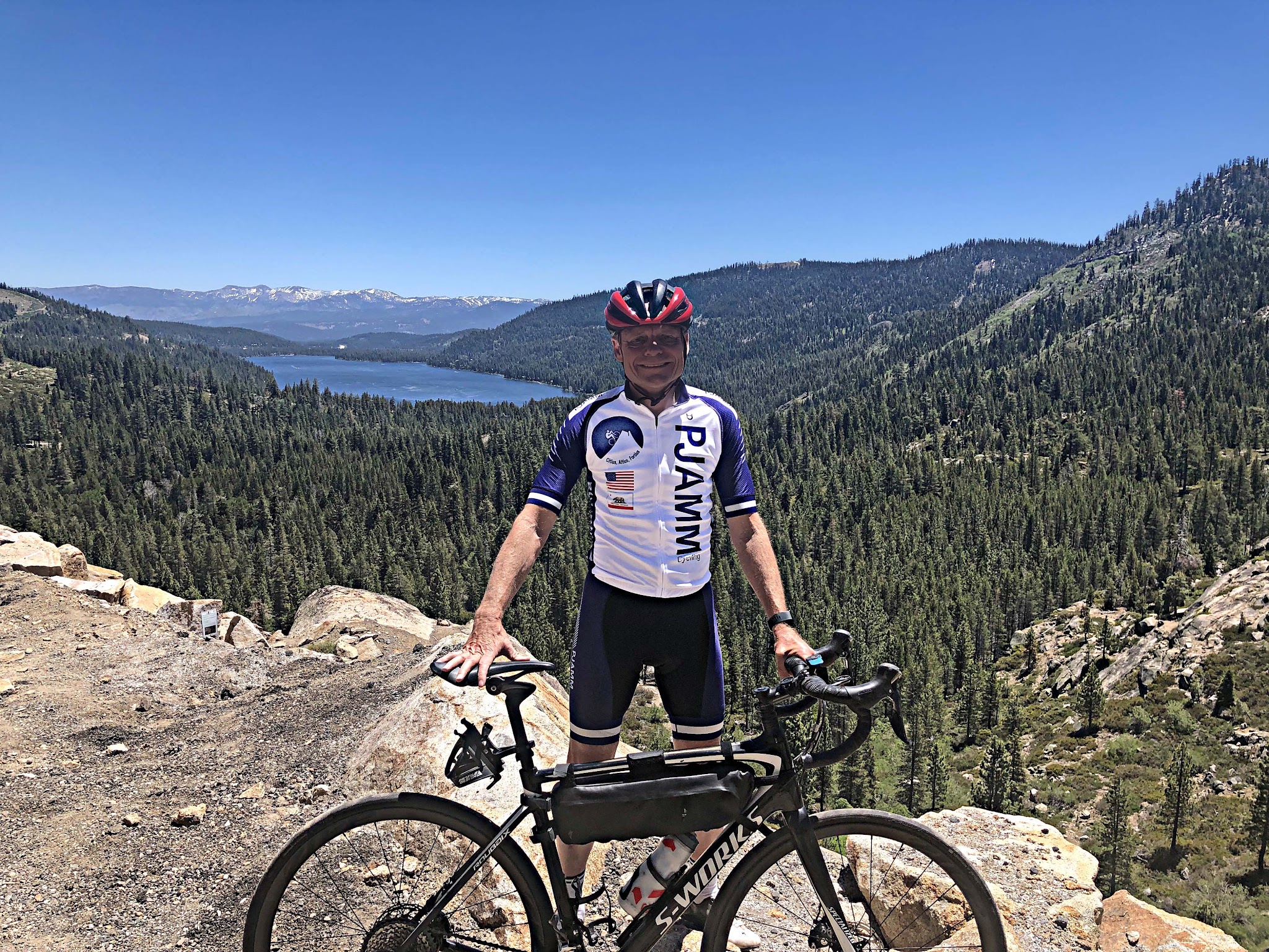 Donner Pass (Donner Summit) Biking Donner Pass (Donner Summit) - John Johnson PJAMM Cycling with bike - donner lake in background