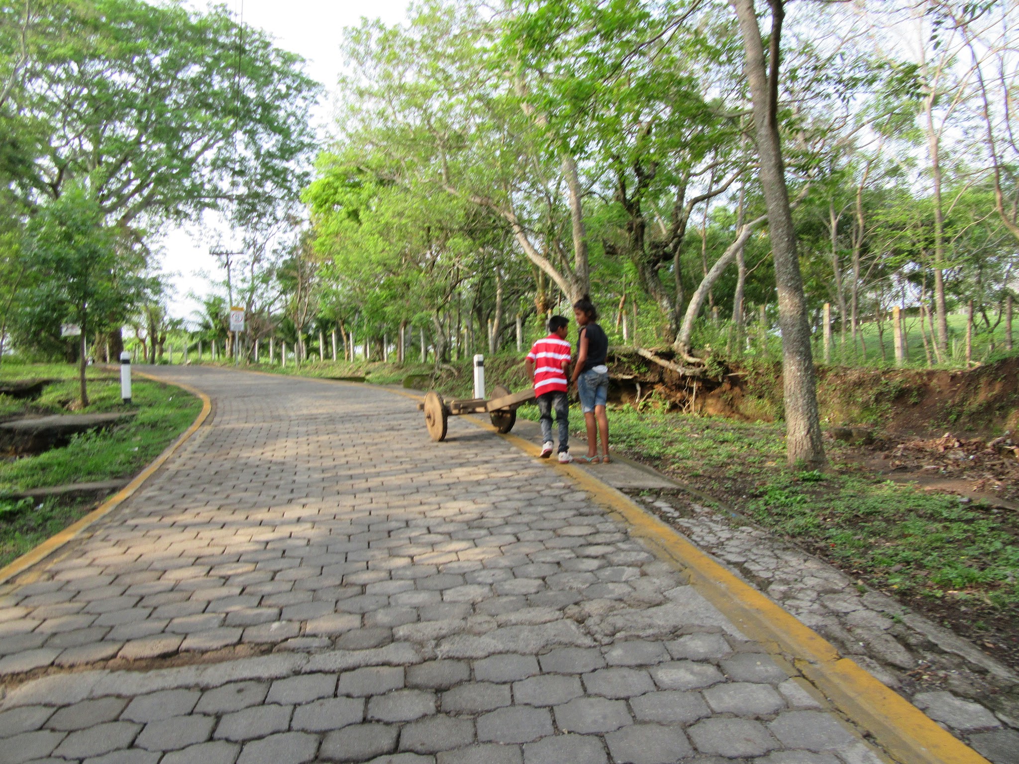 Mombacho Volcano - on the cobbles Climbing Mombacho Volcano by bike - cobbles and children pushing cart