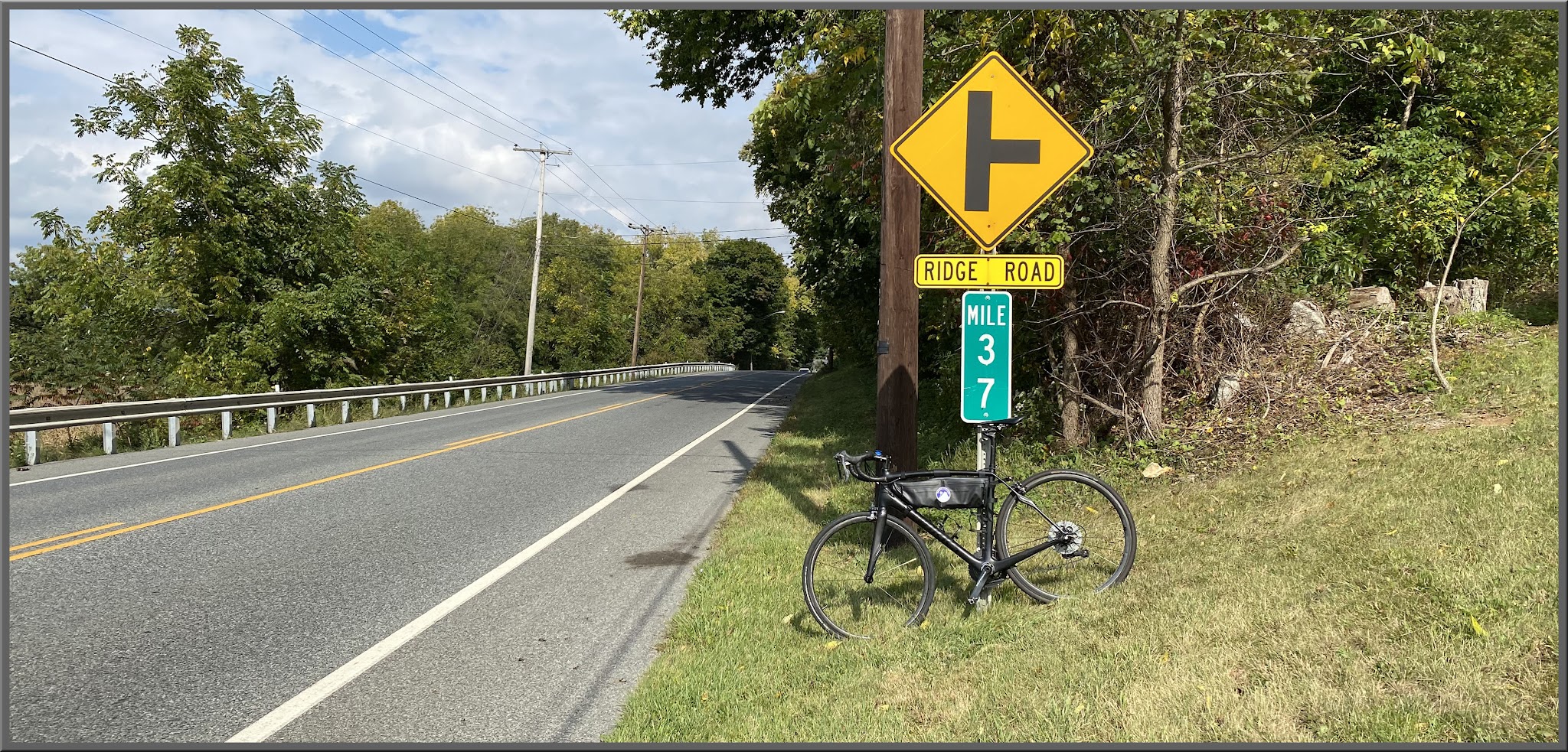 Cycling Fiddlers Elbow, New Jersey Cycling Fiddlers Elbow, New Jersey - bike parked against sign for Mile 37 on roadside