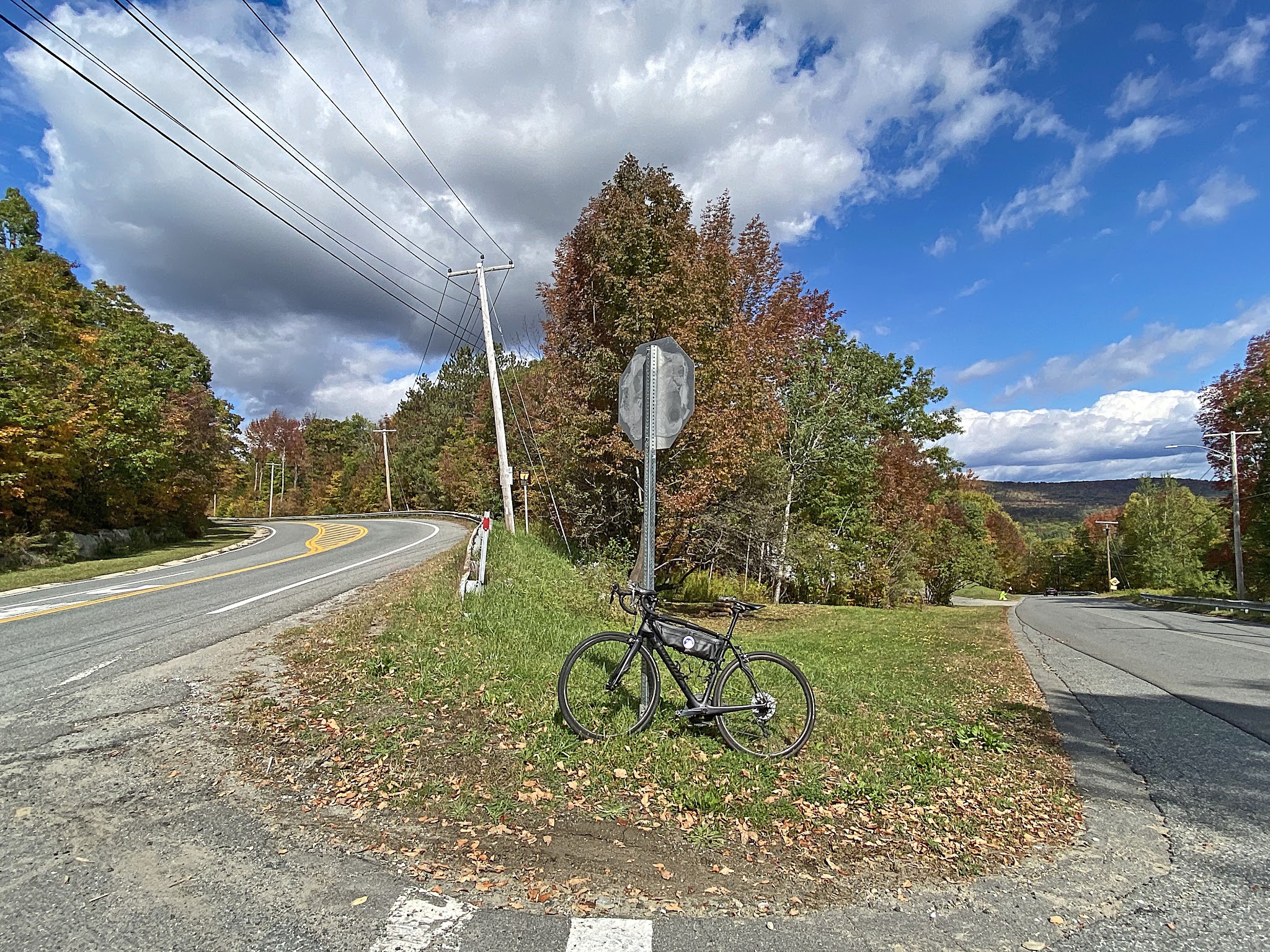 Cycling Whitcomb Hill Road, Massachusetts - bike parked against stop sign at turn from Mohawk Trial/Route 2