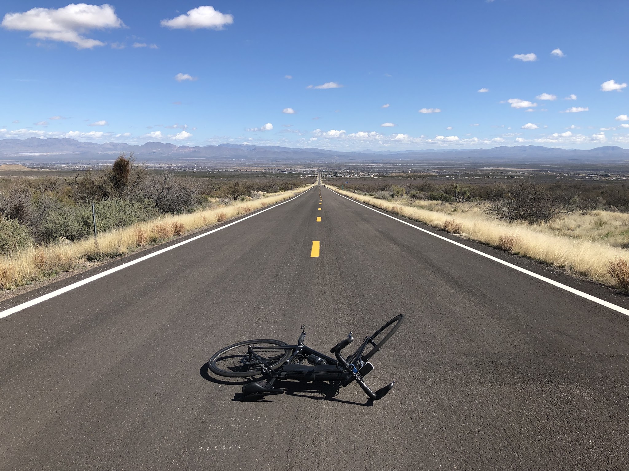 Arizona top bike climbs - Mt. Graham - bike in roadway - long straight road