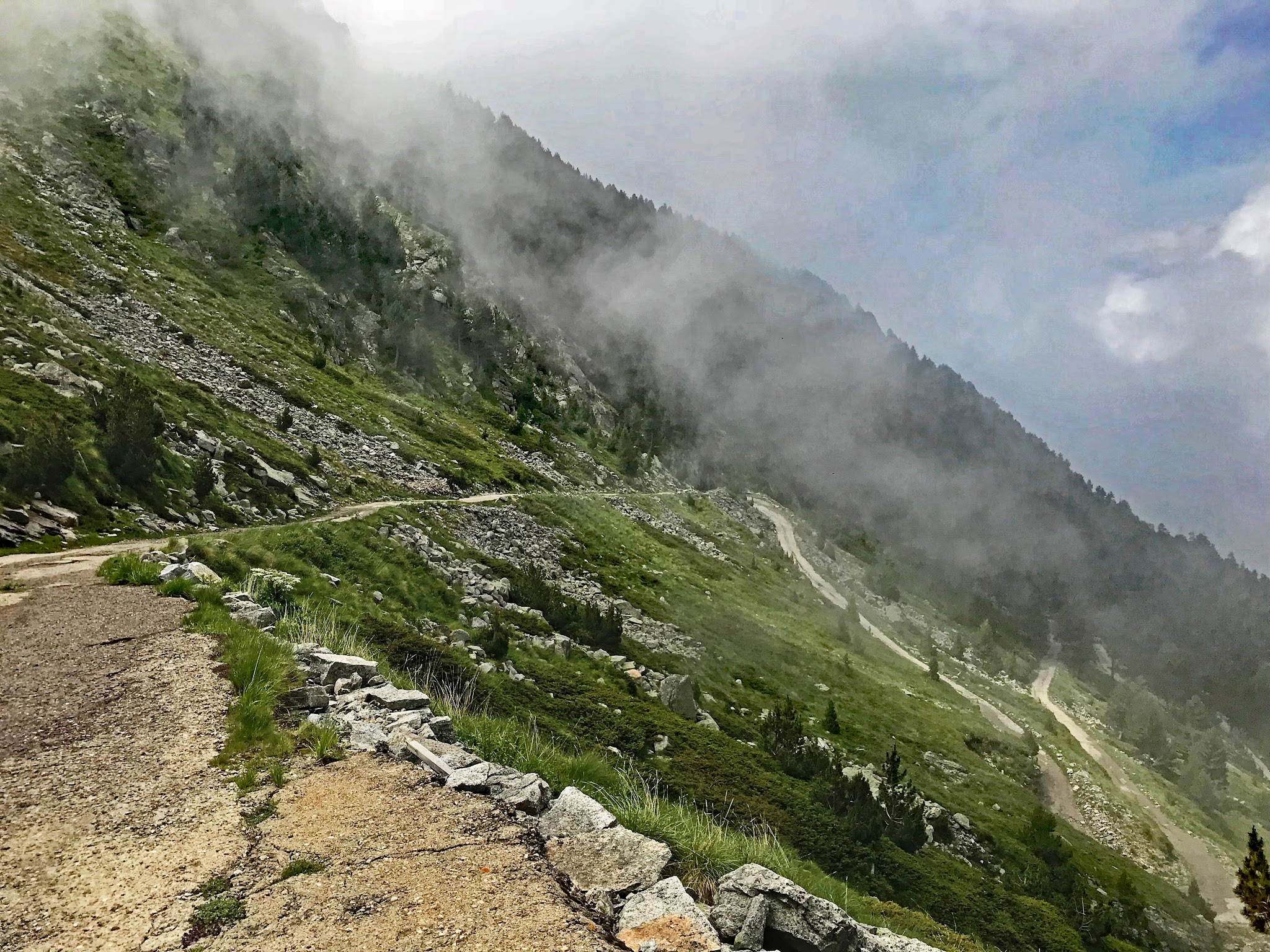 Rough Road and fall colors on leaves of trees on bicycle climb to Rila