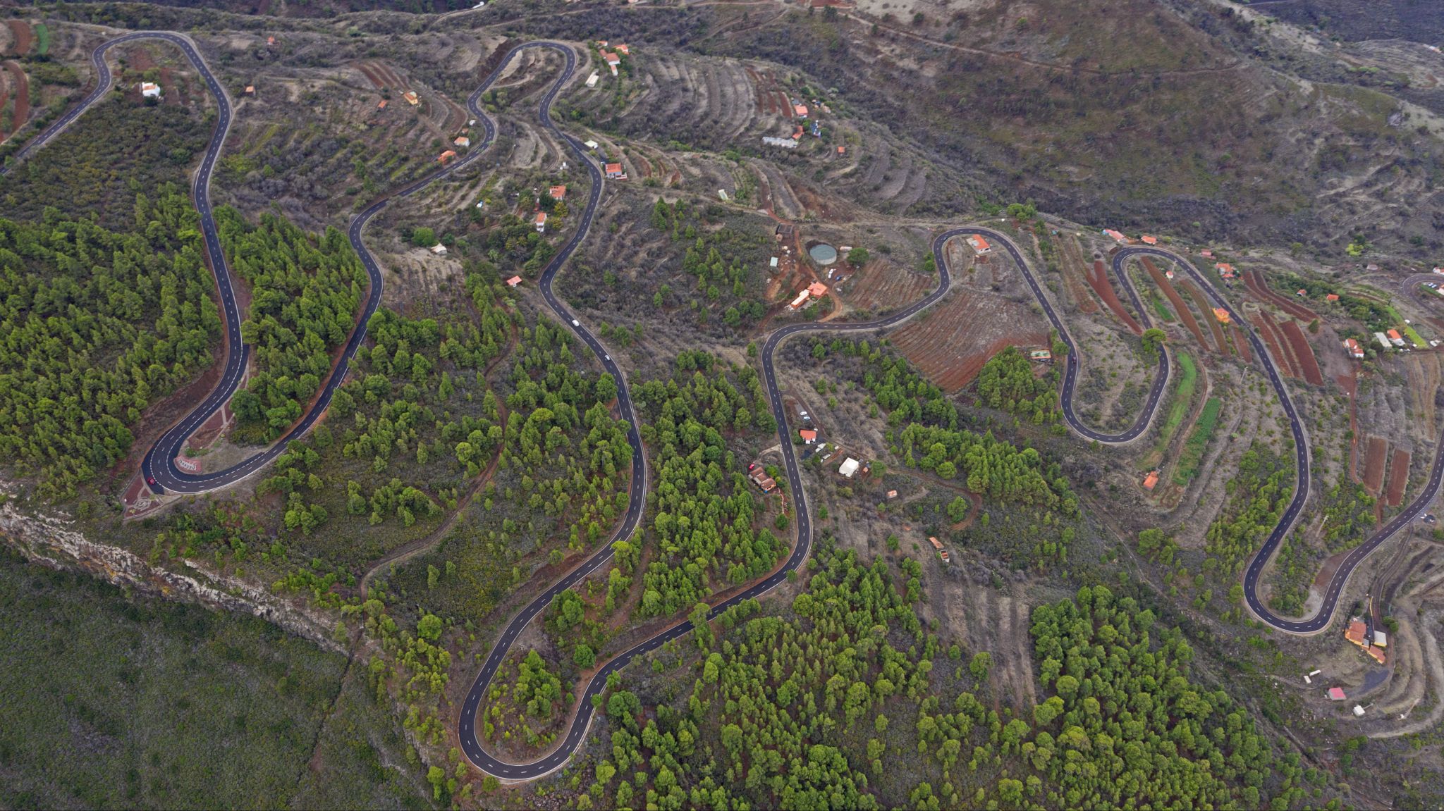 aerial drone view of switchbacks and curving road